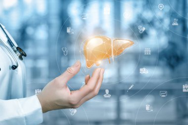 Tıbbi işçi karaciğer üzerinde arka plan bulanık gösterir..