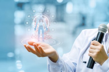 Bir doktor bir mikrofon ile iç organları görüntüleri dijital bir rakam tutuyor iç çevrili. Geliştirme ve yeni teknolojiler morden tıp bir kavramdır.
