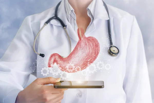 医師の手のデバイス上の歯車方式 ぶら下げ内デジタル胃モデル コンセプトは臓器診断における技術の役割 — ストック写真