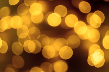 Tatil arka planının altın ışıkları. Soyut, parlak arkaplan, bulanık bokeh.