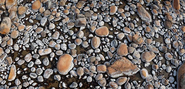 Rock texture, lava rock on the river