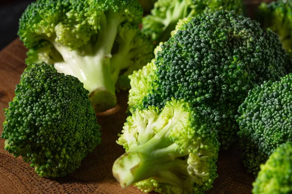 Fresh green broccoli on a wooden butt cutting board