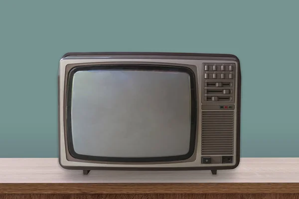 Vintage TV box on wooden table and pastel color background.