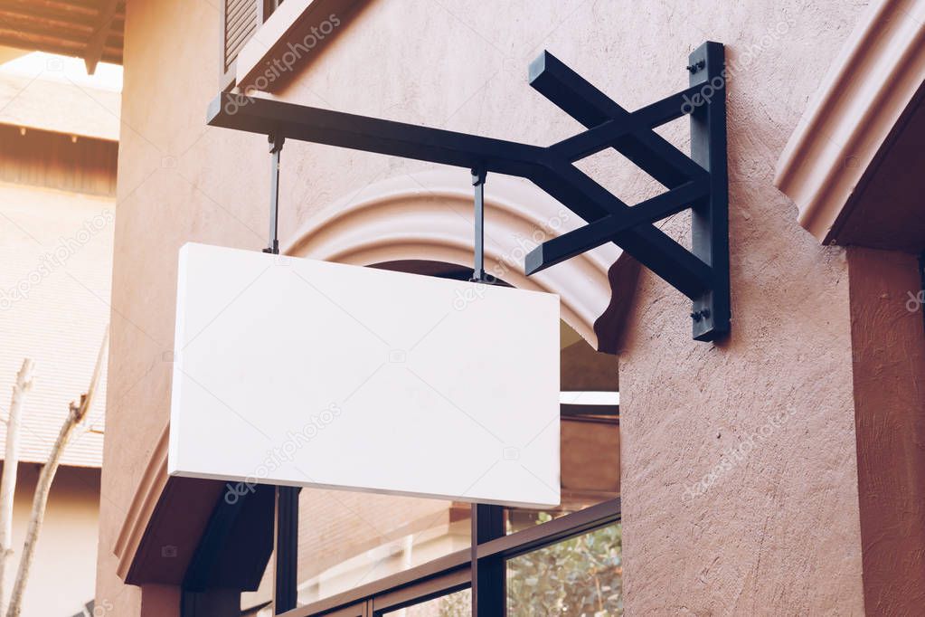 Horizontal blank empty signage on clothes shop front with copy space.