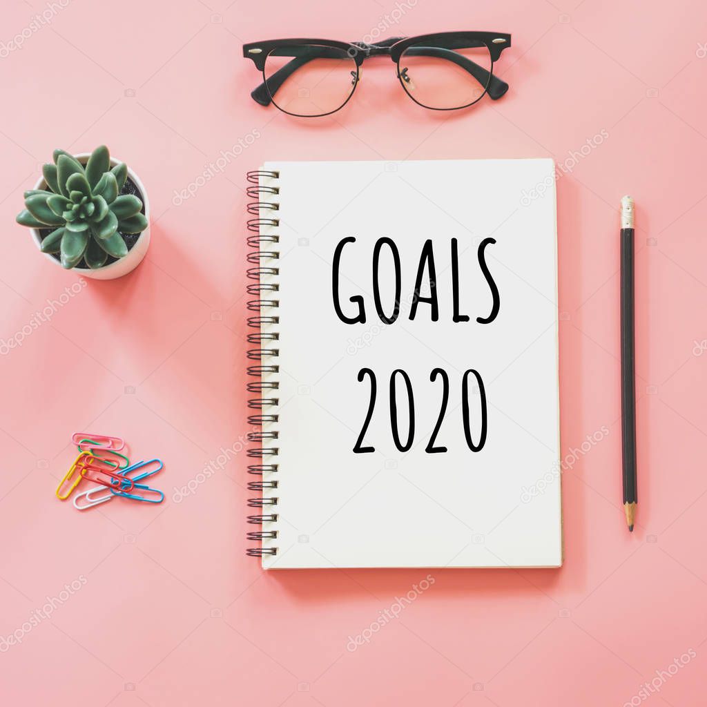 New year concept. Goals 2020 and notepad, smartphone, stationery