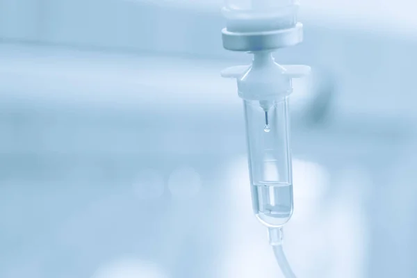 Saline solution drip for treatment patient in the hospital. — Stock Photo, Image