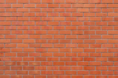 Tuğla işçiliği arka planı ve dokusu için kırmızı renkli tuğla duvar.