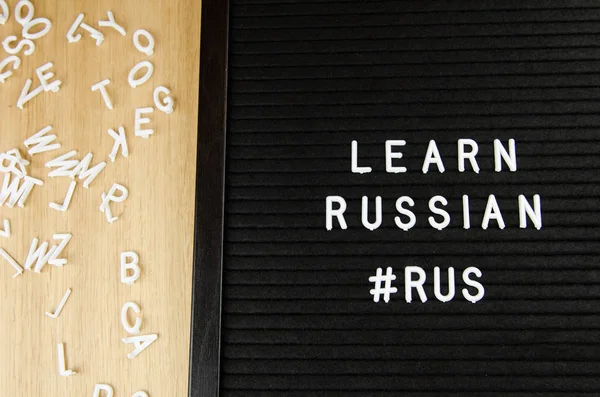 learn Russian language sign on black background
