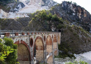 Ancient bridge for transporting marble at Carrara clipart