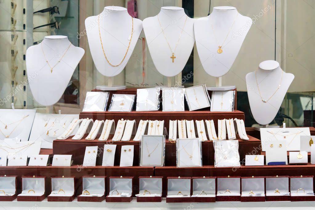 Jewelry diamond rings and necklaces show in luxury retail store window display showcase