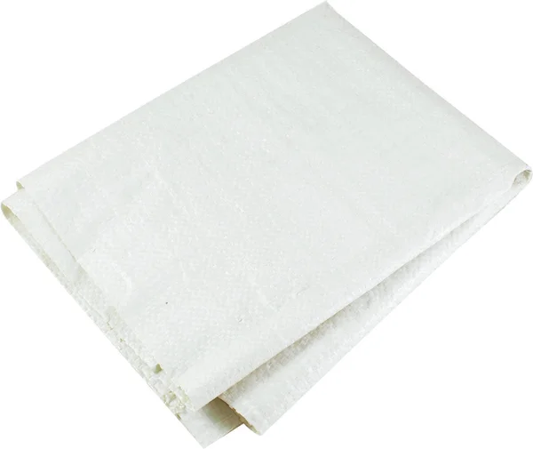 O saco com detritos de construção é feito de um saque sintético branco. Isolado em branco — Fotografia de Stock