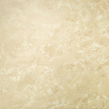 Dokulu arka plan. Dekoratif alçı duvarlar, dış cephe dekorasyonu. Bej rengi.