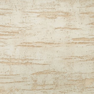 Dokulu arka plan. Dekoratif alçı duvarlar, dış cephe dekorasyonu. Bej rengi