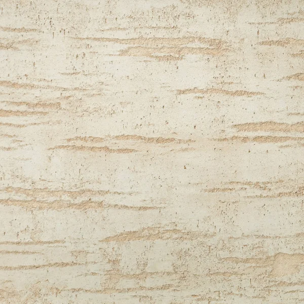 Dokulu arka plan. Dekoratif alçı duvarlar, dış cephe dekorasyonu. Bej rengi