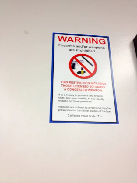 Department of motor vehicles DMV indoor office no firearms warning sign — Stock Photo, Image