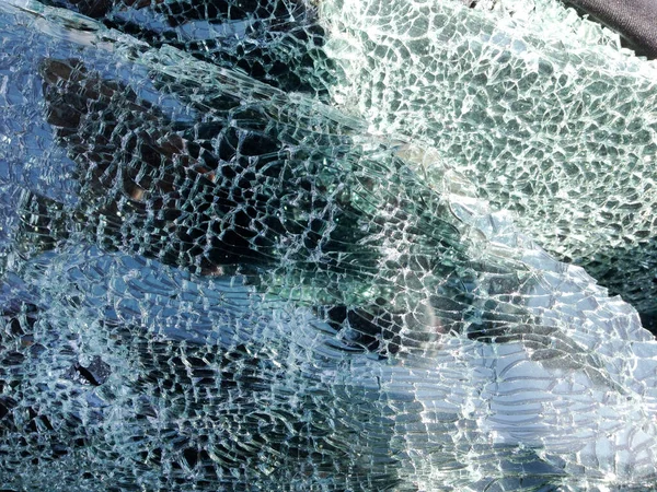 Automobile shot up bullet gun fire holes windshield — Stock Photo, Image