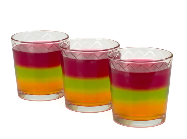 Tre glas med tricolor gelé isolerad på vitt — Stockfoto