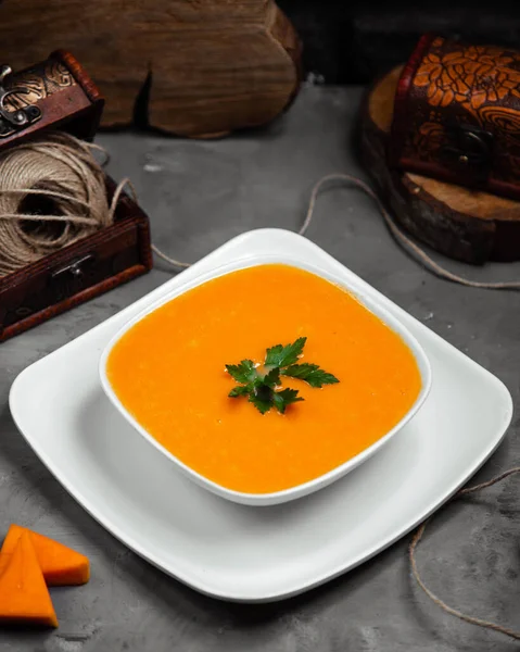 Top view of merci soup with greens in the bowl — Stock Image Top view of merci soup with greens in the bowl Royalty Free Stock Images