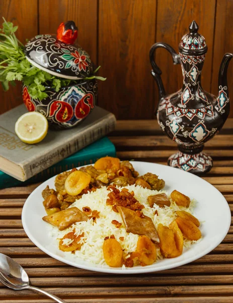 A plate of azerbaijani pilaf with roasted dried fruits, and gazmag — ストック写真