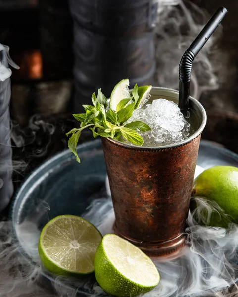 Mojito drink in steel glass with lime, mint and ice — ストック写真