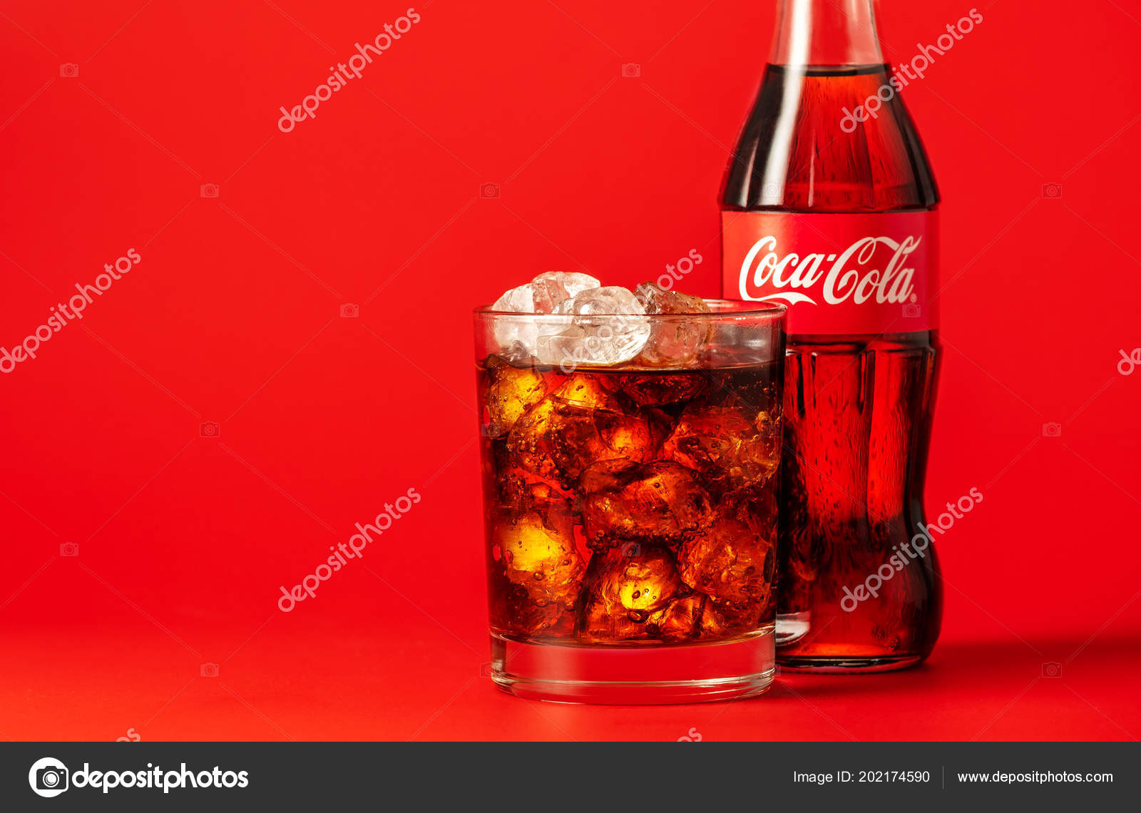 Coca Cola with Ice, Bottle, Glass, Cup Editorial Stock Photo