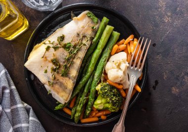 Pike perch fillet with asparagus, broccoli and carrots. Fried fish with stewed greens. clipart