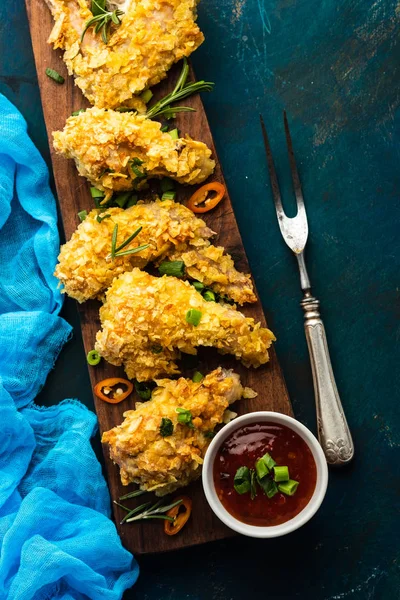 Chicken wings in breading. Deep fried chicken wing. American food. Top view.