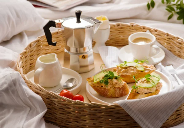 Breakfast in bed in hotel room. A romantic breakfast for your be