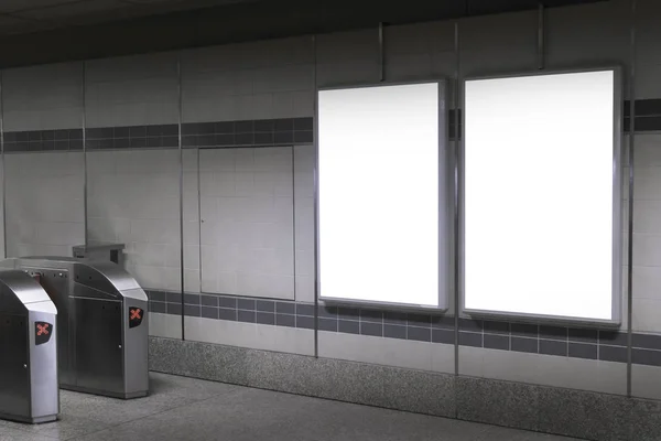 Blank billboard in subway or metro station, Useful for advertising.