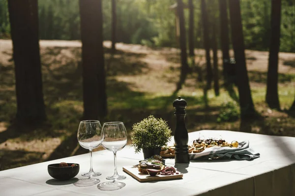 Restaurant looking table with snack in the forest