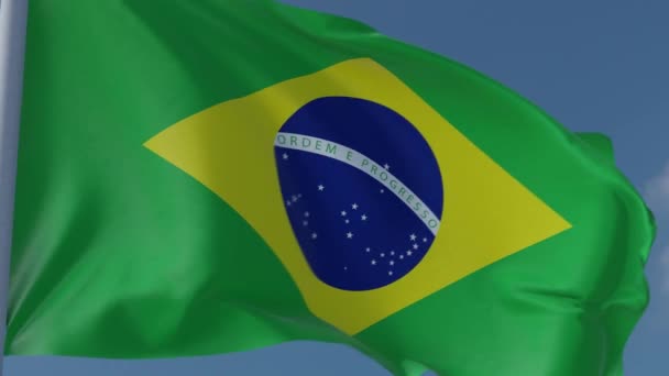 巴西国旗在风中飘扬 蓝天背景特写 — 图库视频影像