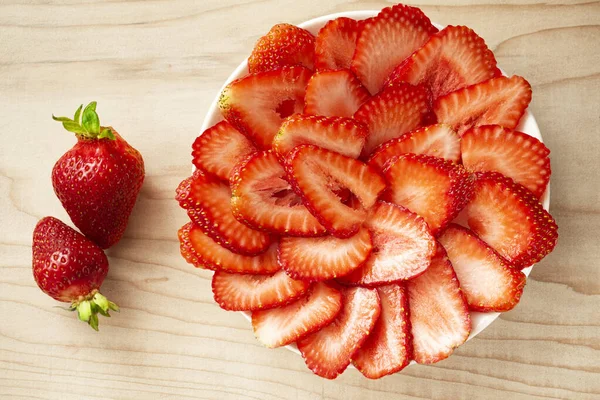 Plate Red Strawberries Sliced Light Wooden Board Next Plate Two — Stock Photo, Image