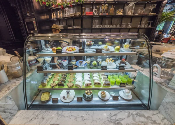 Different Types of Cakes in Pastry Shop Glass Display — Stock Photo, Image