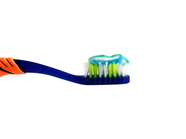 a bright blue toothbrush and toothpaste. Isolate. Dentistry and healthcare concept.