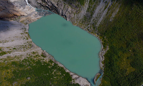 Briksdalsbre glacier lake in july 2019. Aerial top view from drone.