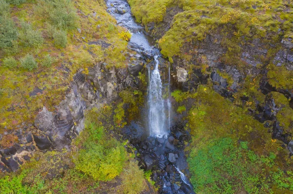 Iceland waterfall nature landscape in Icelandic nature background. Popular tourist attraction summer holiday destination in on South Iceland. Aerial drone view of top water falls. Thjothveldisbaerinn — Stock Photo, Image