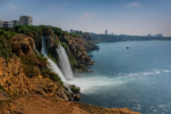 Duden lower waterfalls cascade in the sea at Antalya, Turkey. July 2020, long exposure picture