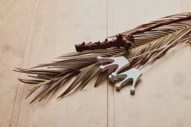 flat view holiday and carnaval accessories on natural wooden background