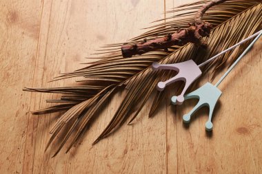 flat view holiday and carnaval accessories on natural wooden background