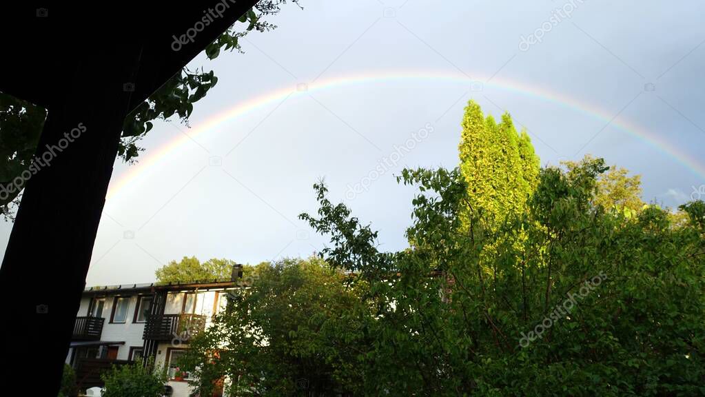 The rainbow came out after the rain in my neighborhood