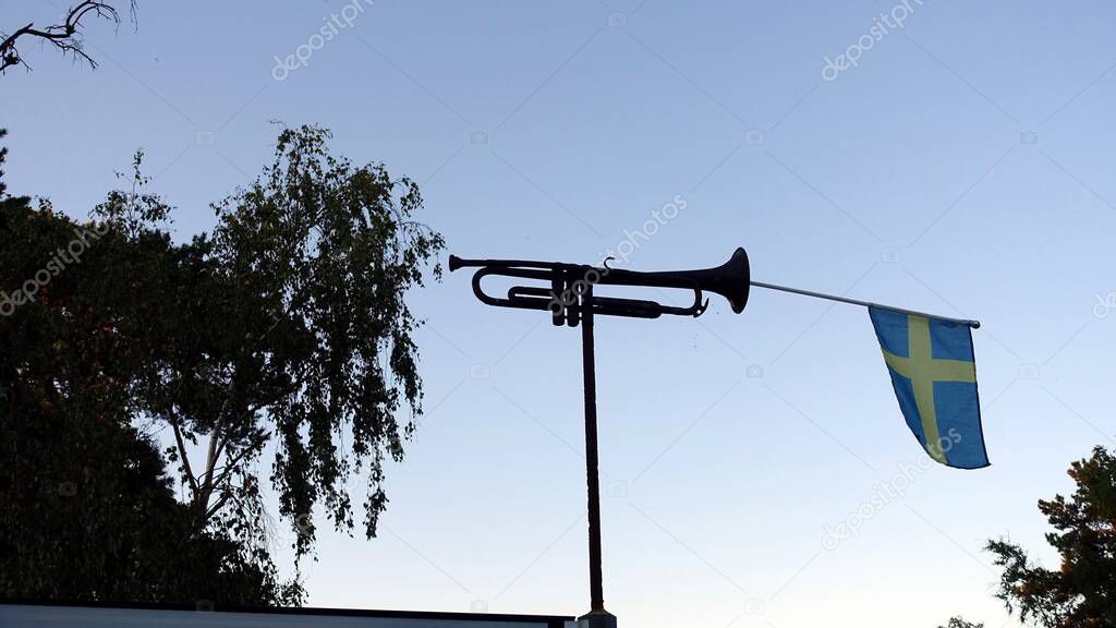 Image representing a trumpet with the Swedish flag tucked inside