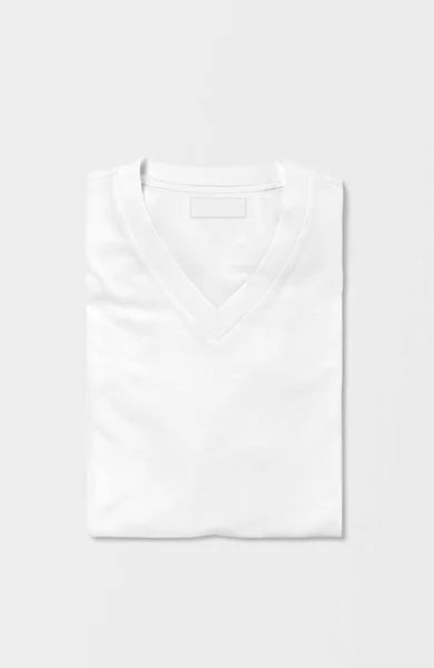 孤立した背景に白い無地の男性の女性VネックTシャツを折ります トップ表示 — ストック写真