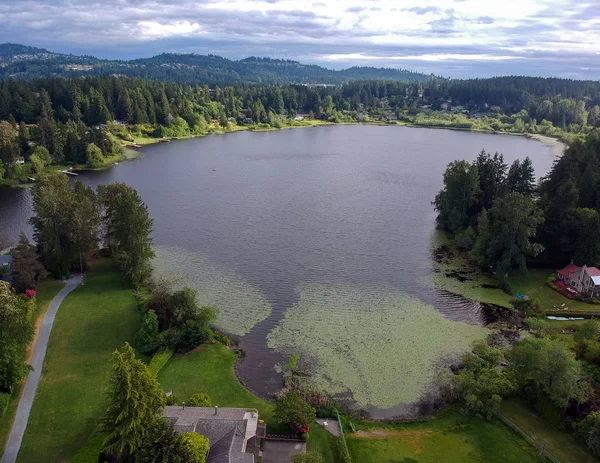 Picturesque Phantom Lake and the surrounding sprawling communities of Robinswood, Lake Hill and West Lake Sammamish in Bellevue, Washington.