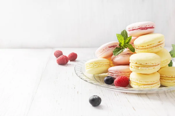 Diferentes Tipos Macarons Mesa Madeira Branca Espaço Cópia — Fotografia de Stock