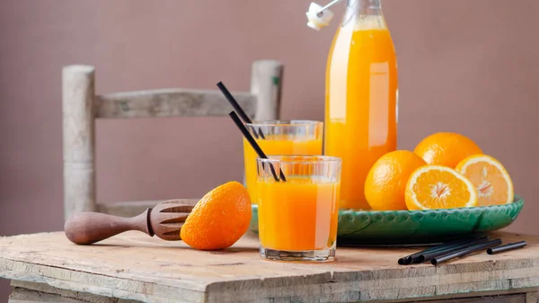 Fresh homemade orange juice in glass for breakfast on wooden table .Rustic stile. Free text space.