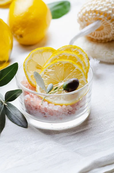 Ingredients for body scrub of pink salt with lemon and olive oil