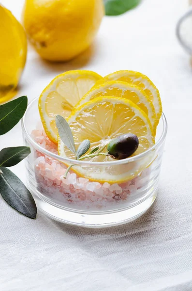 Ingredients for body scrub of pink salt with lemon and olive oil — Stock Photo, Image