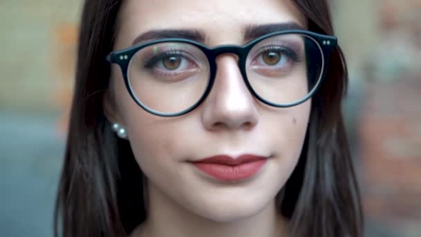 Face portrait close up, beautiful young girl looking at camera — Video