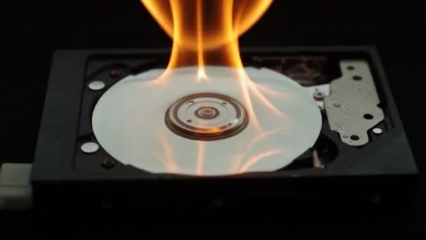 Burning two hard disk drives on dark ground — Stock Video
