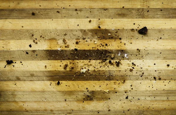 A bite of bread with cumin and bread crumbs on a wooden stand